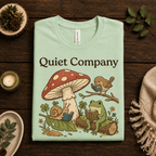 A folded mockup of Quiet Company nature lovers graphic t-shirt in mint.