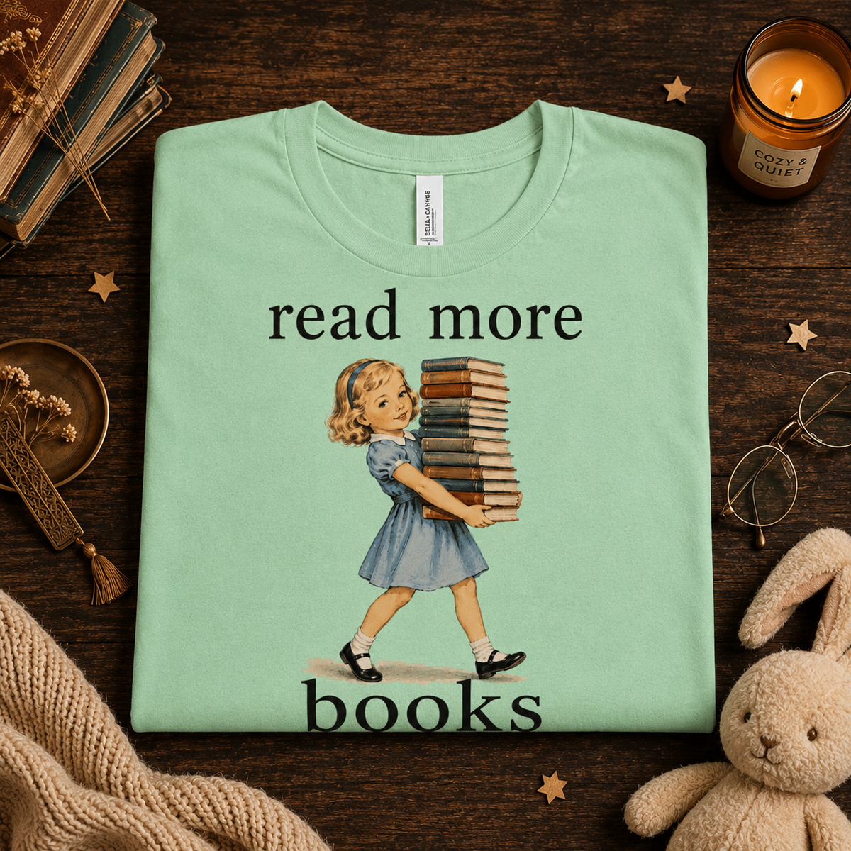 A folded mockup of Read More vintage book graphic t-shirt in mint.