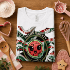 Folded mock up of Melon Majesty graphic t-shirt in white, surrounded by small kitchen utensils.