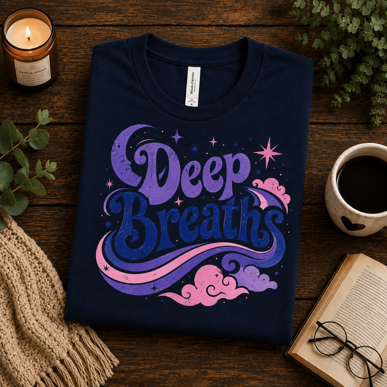 A folded mockup of Deep Breaths inspirational introvert graphic t-shirt in navy.