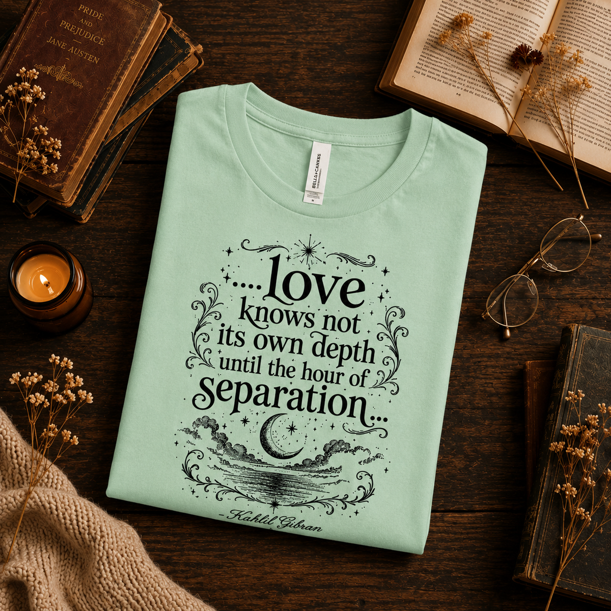 A folded mockup of Love Knows Not book quote graphic t-shirt in mint.