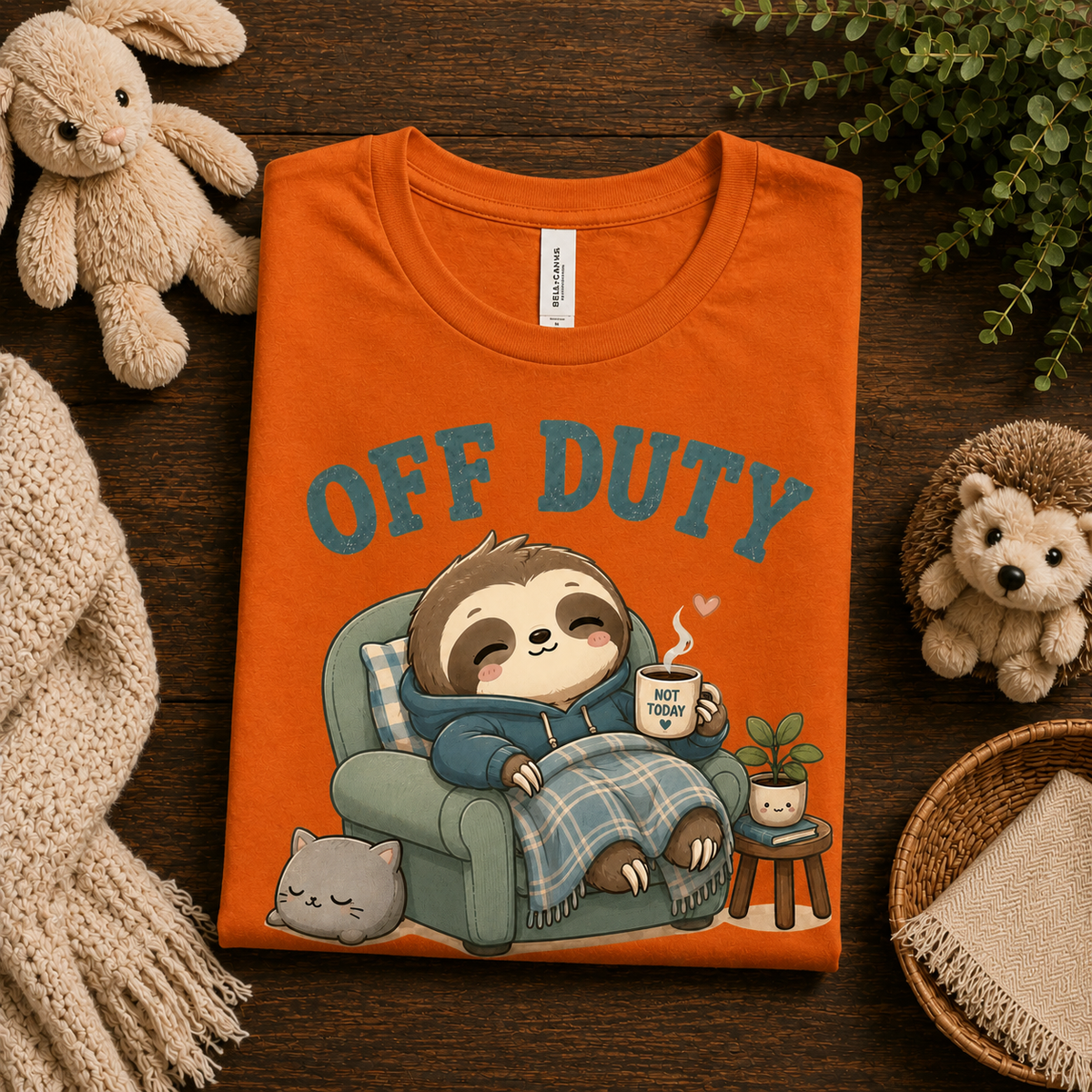 A folded mockup of Off Duty cute animal graphic t-shirt in burnt orange.