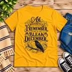 Bleak December book quote graphic t-shirt cozy flat lay in gold.
