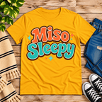 Miso Sleepy funny food graphic t-shirt cozy flat lay in gold.