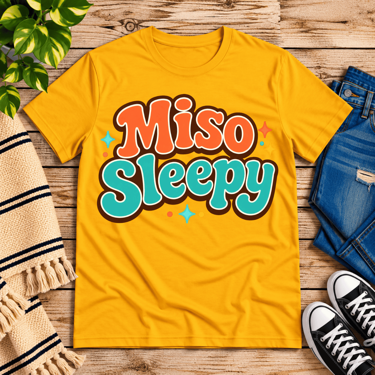 Miso Sleepy funny food graphic t-shirt cozy flat lay in gold.