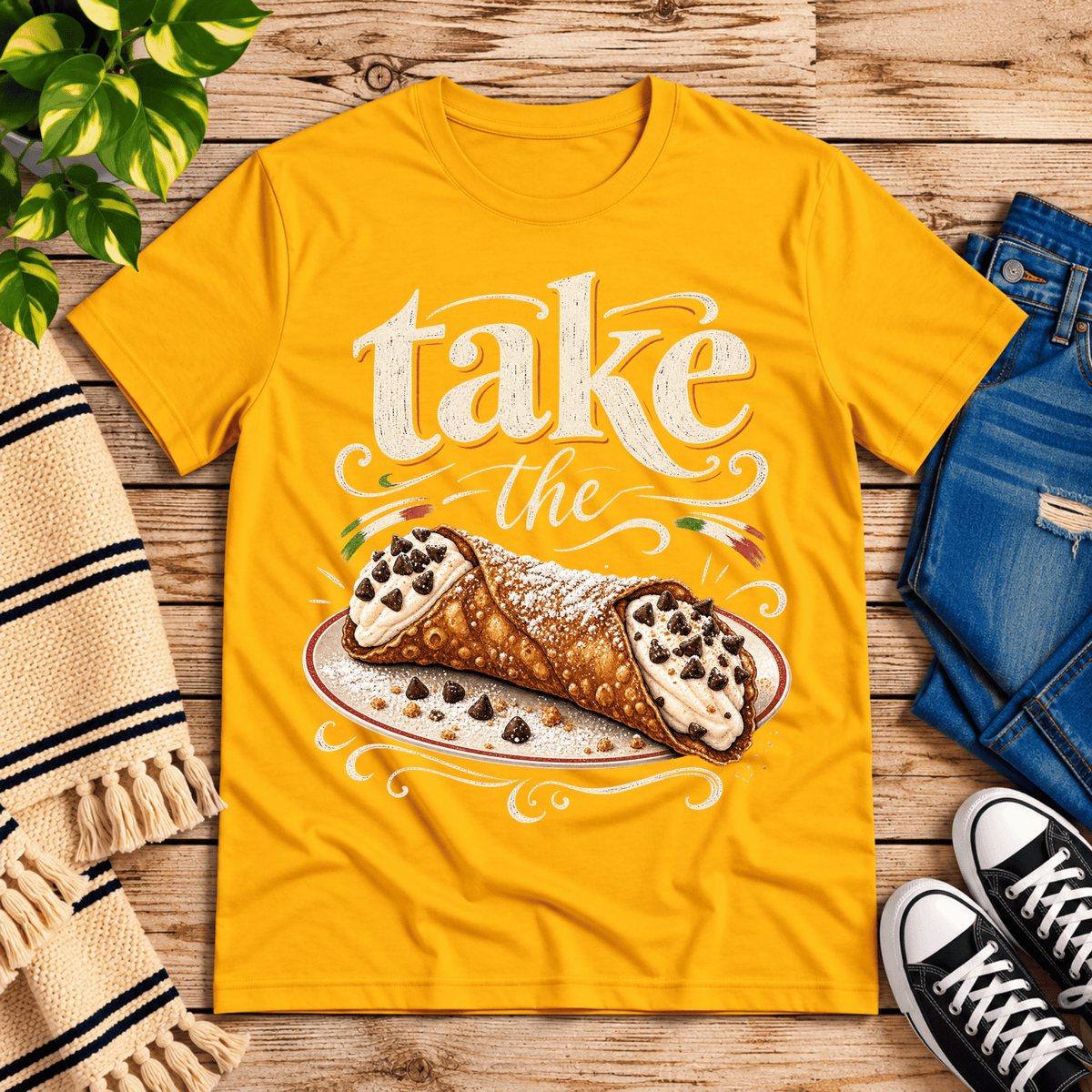 Cannoli cute food graphic t-shirt cozy flat lay in gold.