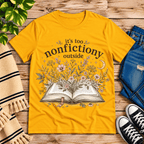 Nonfictiony whimsical book graphic t-shirt cozy flat lay in gold.