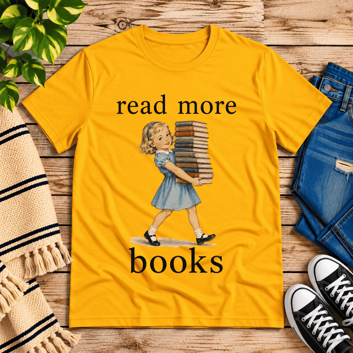 Read More vintage book graphic t-shirt cozy flat lay in gold.