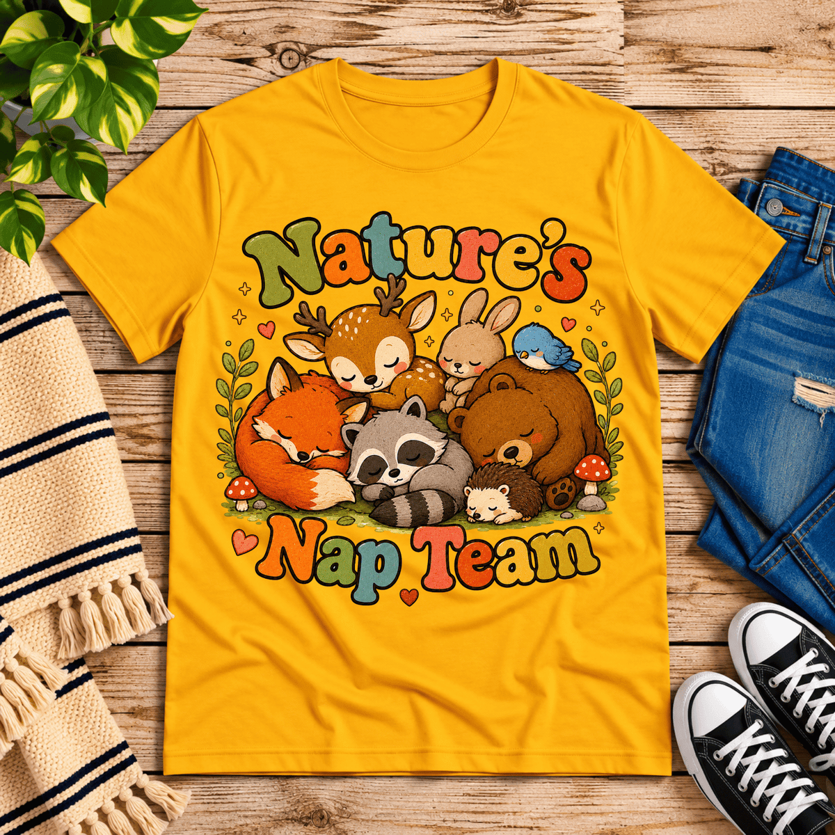 Nature's Nap Team cute animal graphic t-shirt cozy flat lay in gold.