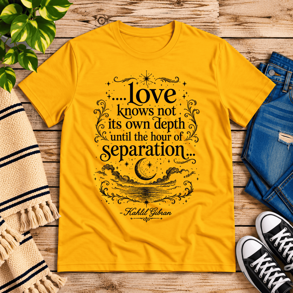 Love Knows Not book quote graphic t-shirt cozy flat lay in gold.
