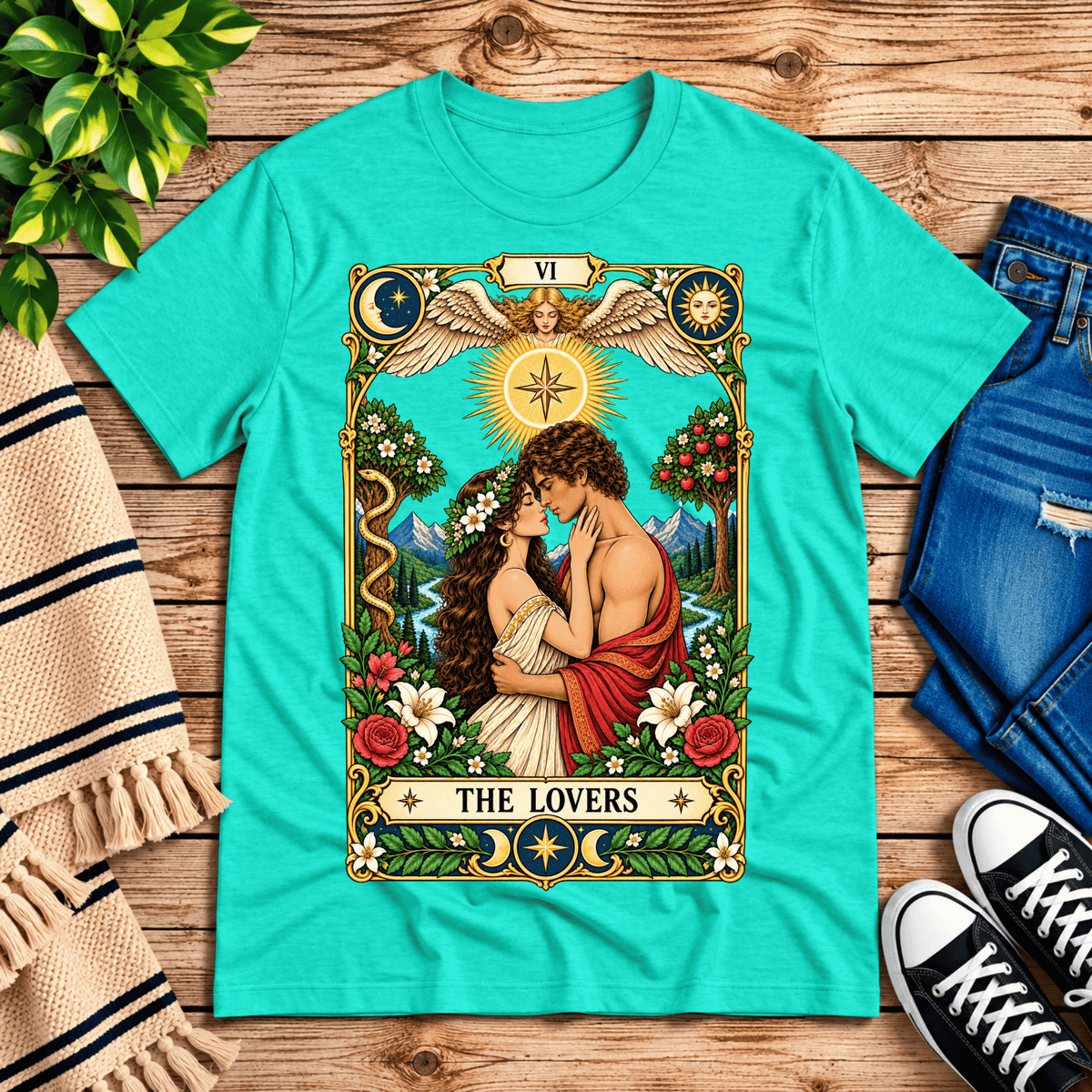 The Lovers tarot card graphic t-shirt cozy flat lay in heather sea green.