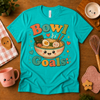 Bowl Goals cute food graphic t-shirt cozy flat lay in heather sea green.