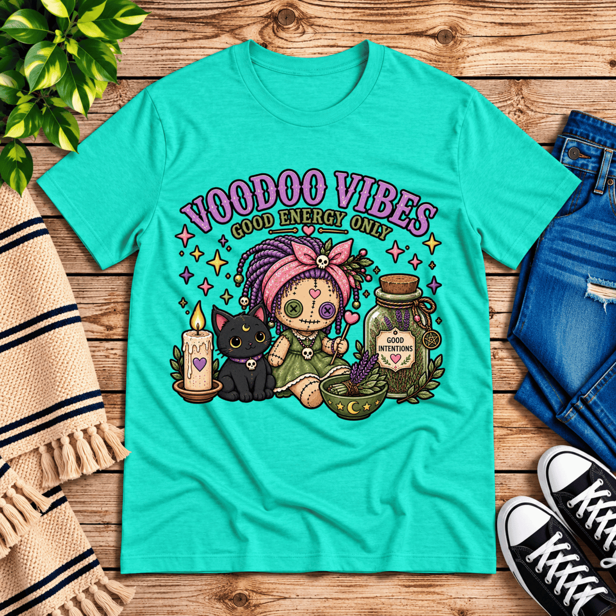 Voodoo Vibes cute magic graphic t-shirt cozy flat lay in heather sea green.