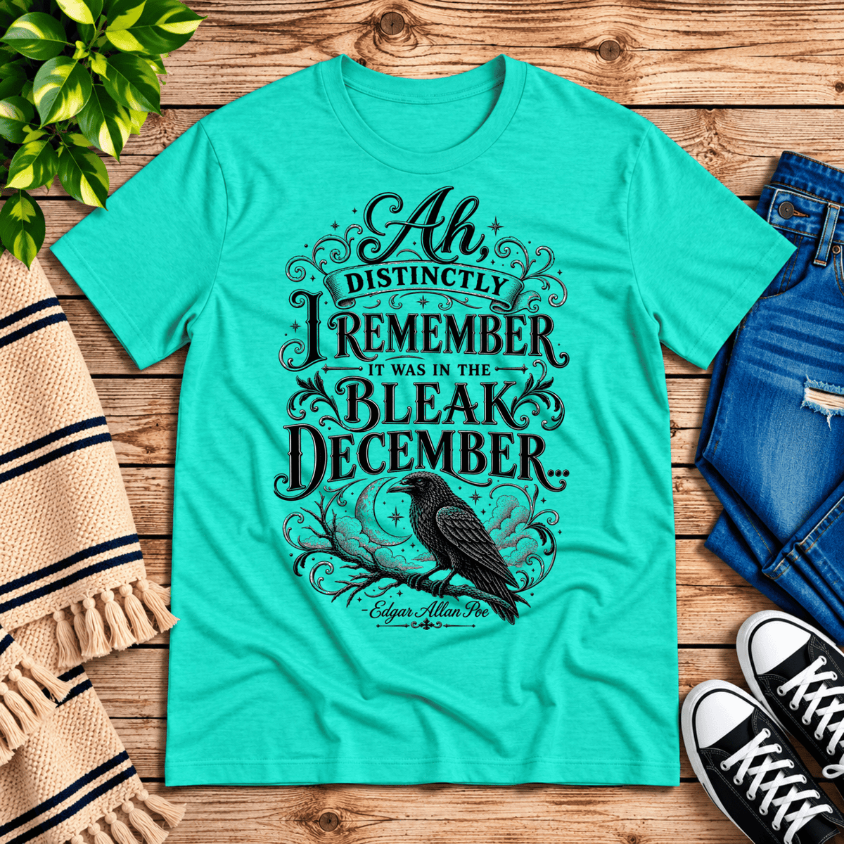 Bleak December book quote graphic t-shirt cozy flat lay in heather sea green.