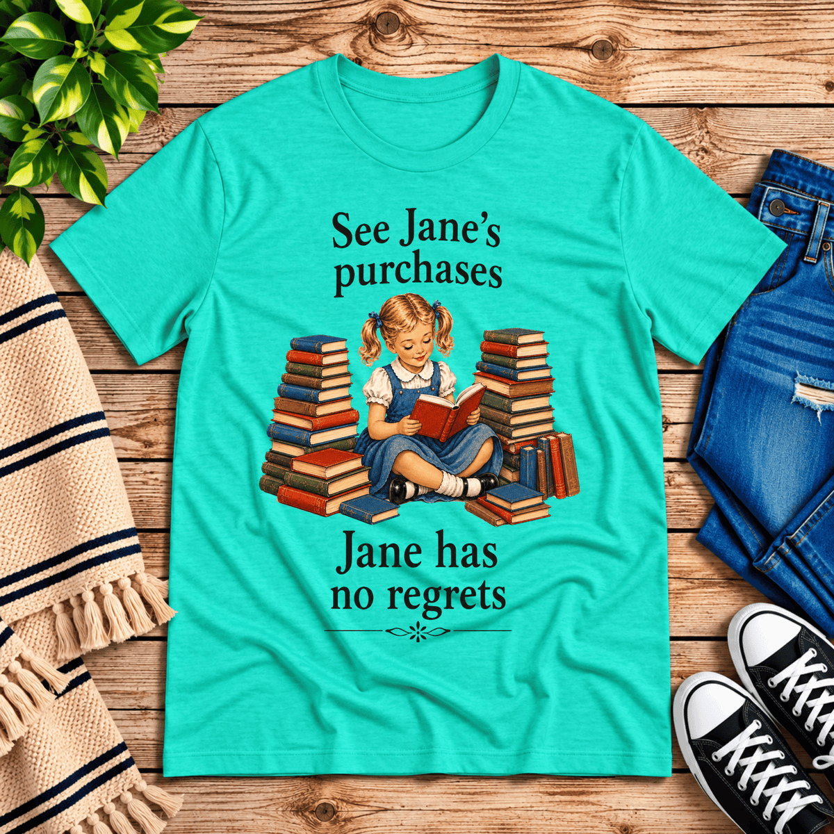 See Jane's Purchases vintage book graphic t-shirt cozy flat lay in heather sea green.