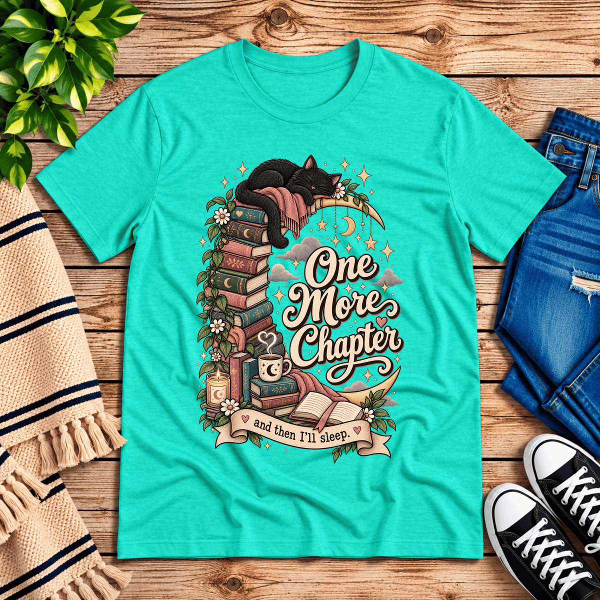 One More Chapter cute book graphic t-shirt cozy flat lay in heather sea green.