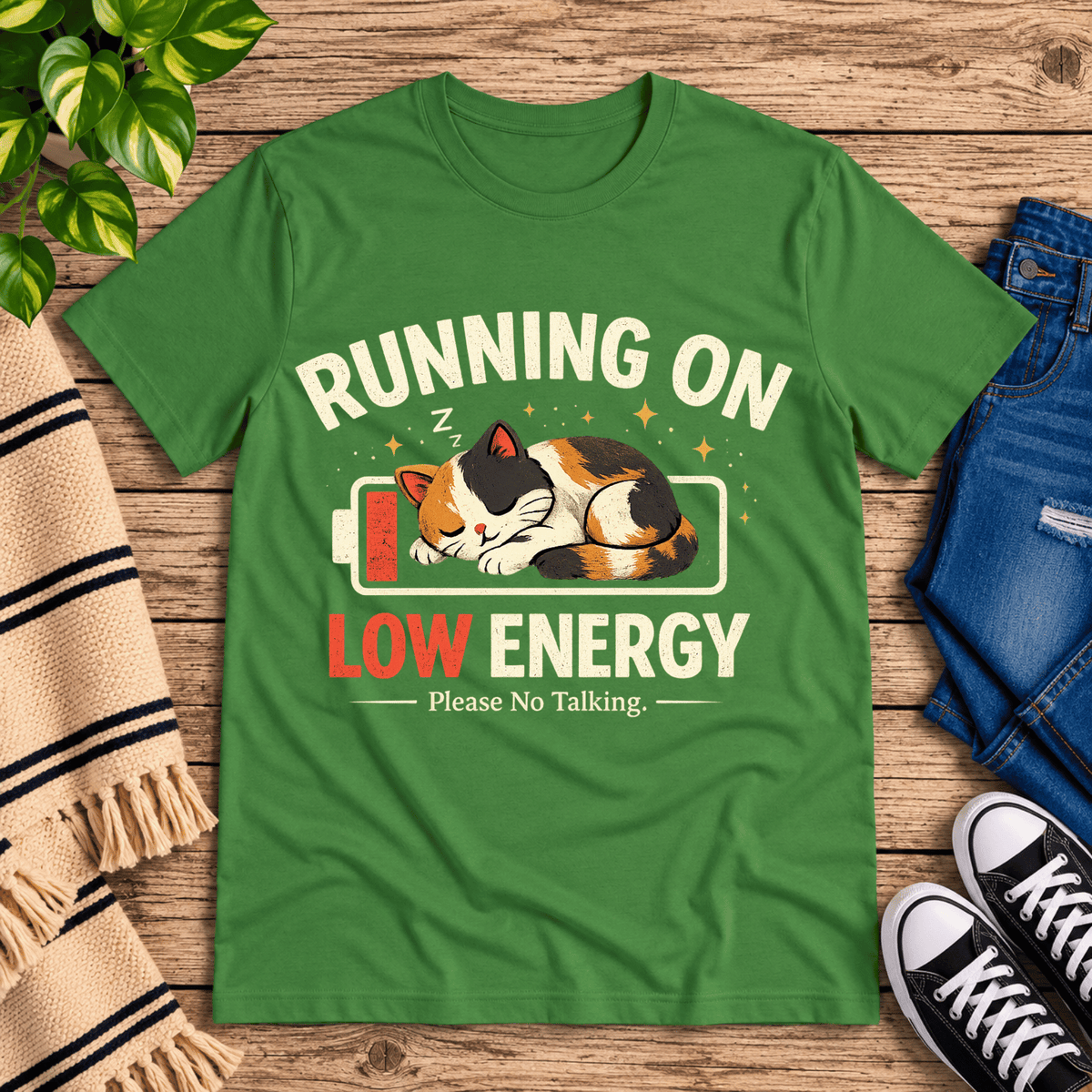 Low Energy Cat cute animal graphic t-shirt cozy flat lay in leaf.