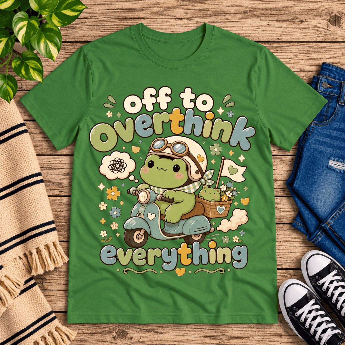 Overthink Frog cute animal graphic t-shirt cozy flat lay in leaf.