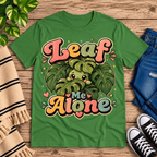 Leaf Me Alone funny nature graphic t-shirt cozy flat lay in leaf.