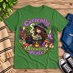 Currently Brewing cute witchy graphic t-shirt cozy flat lay in leaf.