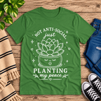 Planting My Peace cute plant graphic t-shirt cozy flat lay in leaf.