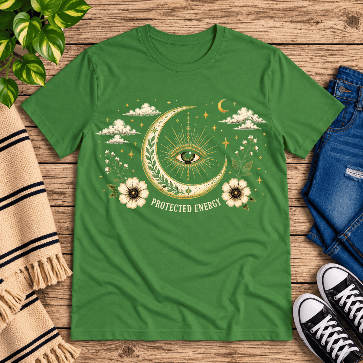 Protected Energy celestial mystic graphic t-shirt cozy flat lay in leaf.