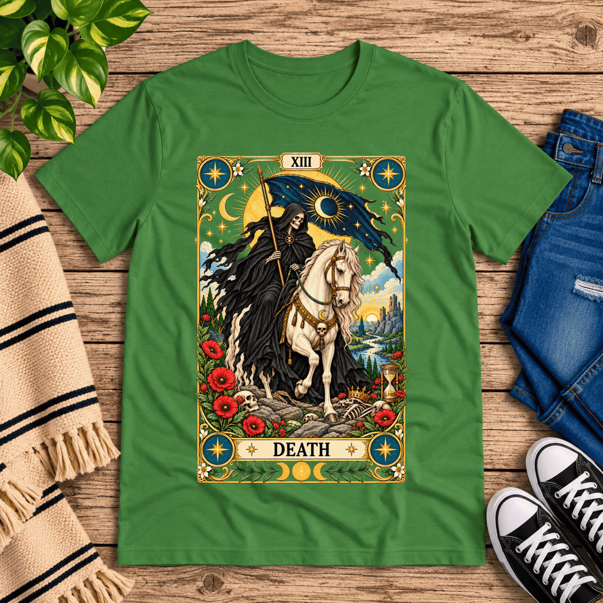 Death tarot card graphic t-shirt cozy flat lay in leaf.