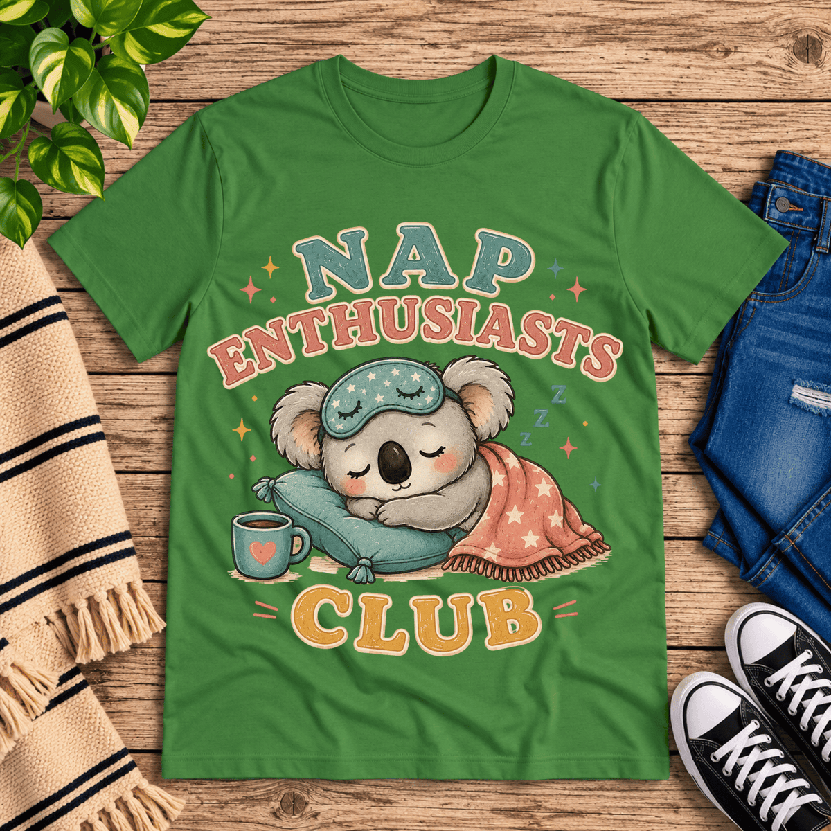 Nap Enthusiasts Club cute animal graphic t-shirt cozy flat lay in leaf.