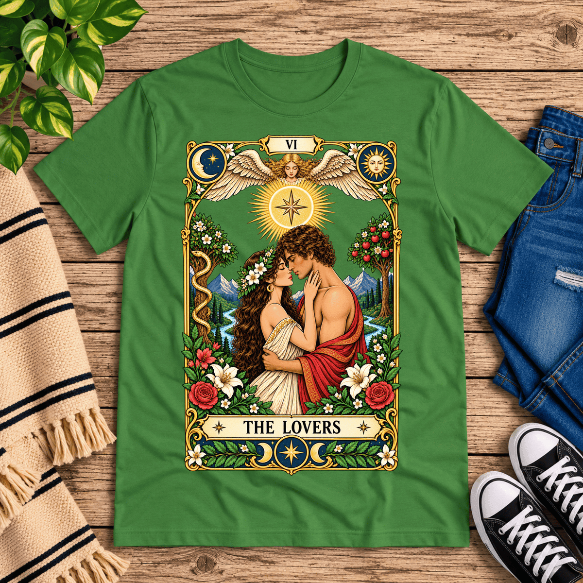 The Lovers tarot card graphic t-shirt cozy flat lay in leaf.