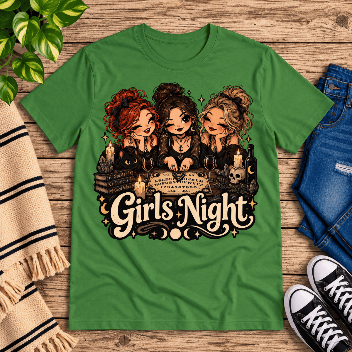 Girls Night witchy celestial graphic t-shirt cozy flat lay in leaf.