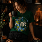 A woman wearing an evergreen Good Luck In Blue cute celestial graphic t-shirt drinking coffee.