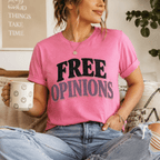 A woman wearing a charity pink Free Opinions funny introvert graphic t-shirt drinking coffee.