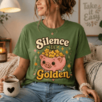 A woman wearing a leaf Silence Is Golden funny introvert graphic t-shirt drinking coffee.