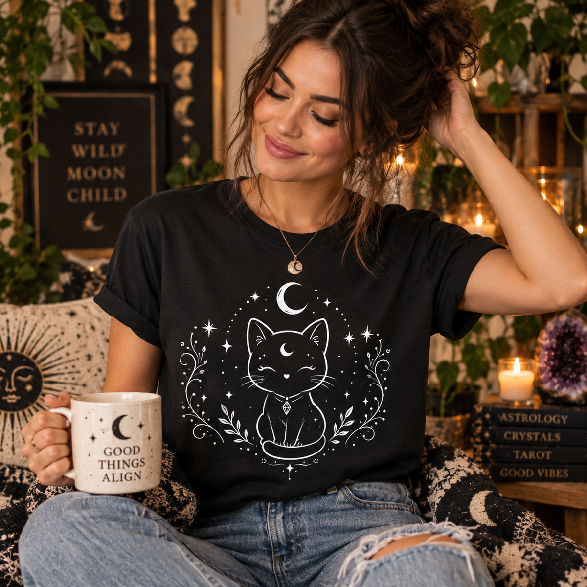 A woman wearing a vintage black Mystical Cat celestial graphic t-shirt.