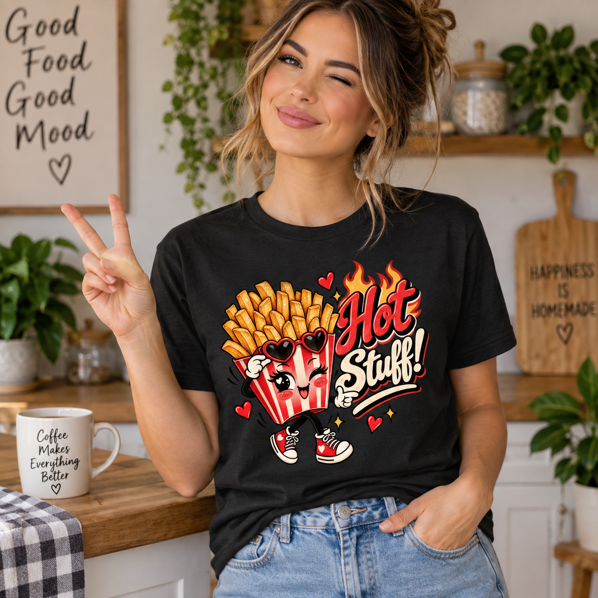 A woman wearing a vintage black Hot Stuff retro food graphic t-shirt.