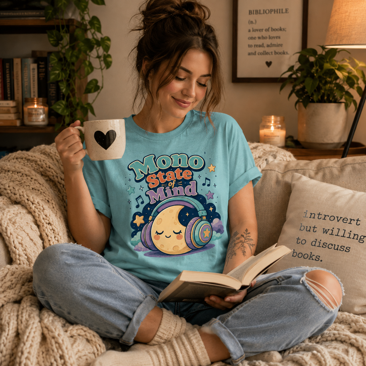A woman wearing a aqua Mono State Of Mind funny introvert graphic t-shirt drinking coffee.