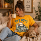 A woman wearing a gold Off Duty cute animal graphic t-shirt petting dog.