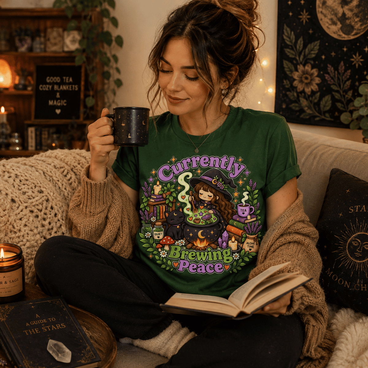 A woman wearing an evergreen Currently Brewing cute witchy graphic t-shirt drinking coffee.