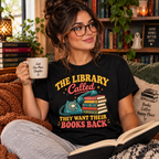 A woman wearing a vintage black The Library Called book lovers graphic t-shirt white reading.