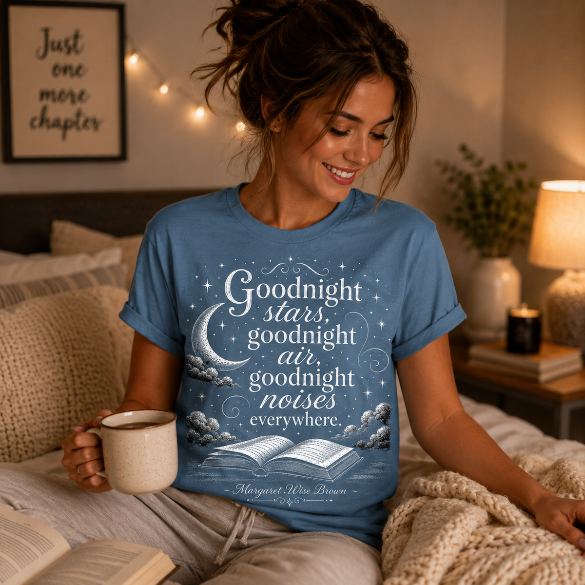 A woman wearing a steel blue book quote graphic t-shirt.