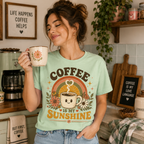 Woman in mint Coffee Is My Sunshine coffee graphic t-shirt drinking coffee in kitchen.