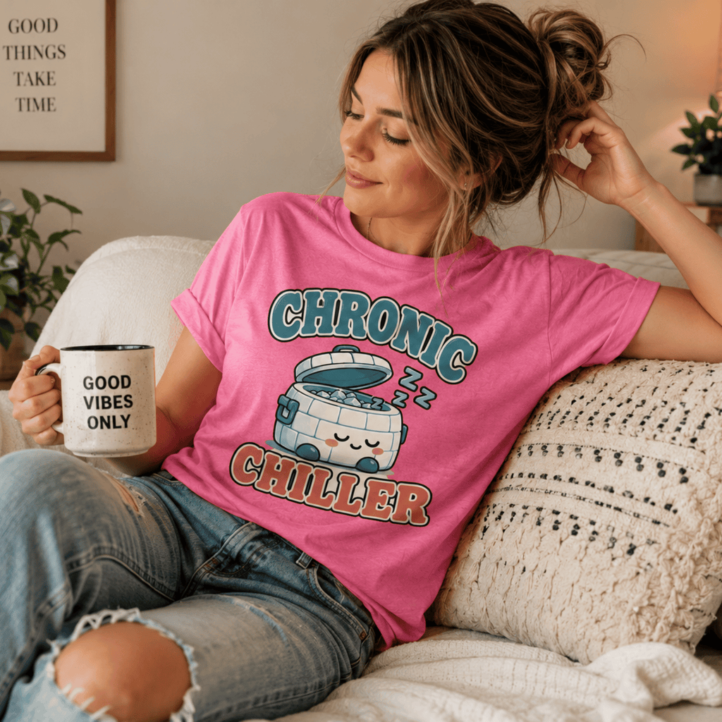 A woman wearing a charity pink Chronic Chiller funny introvert graphic t-shirt drinking coffee.