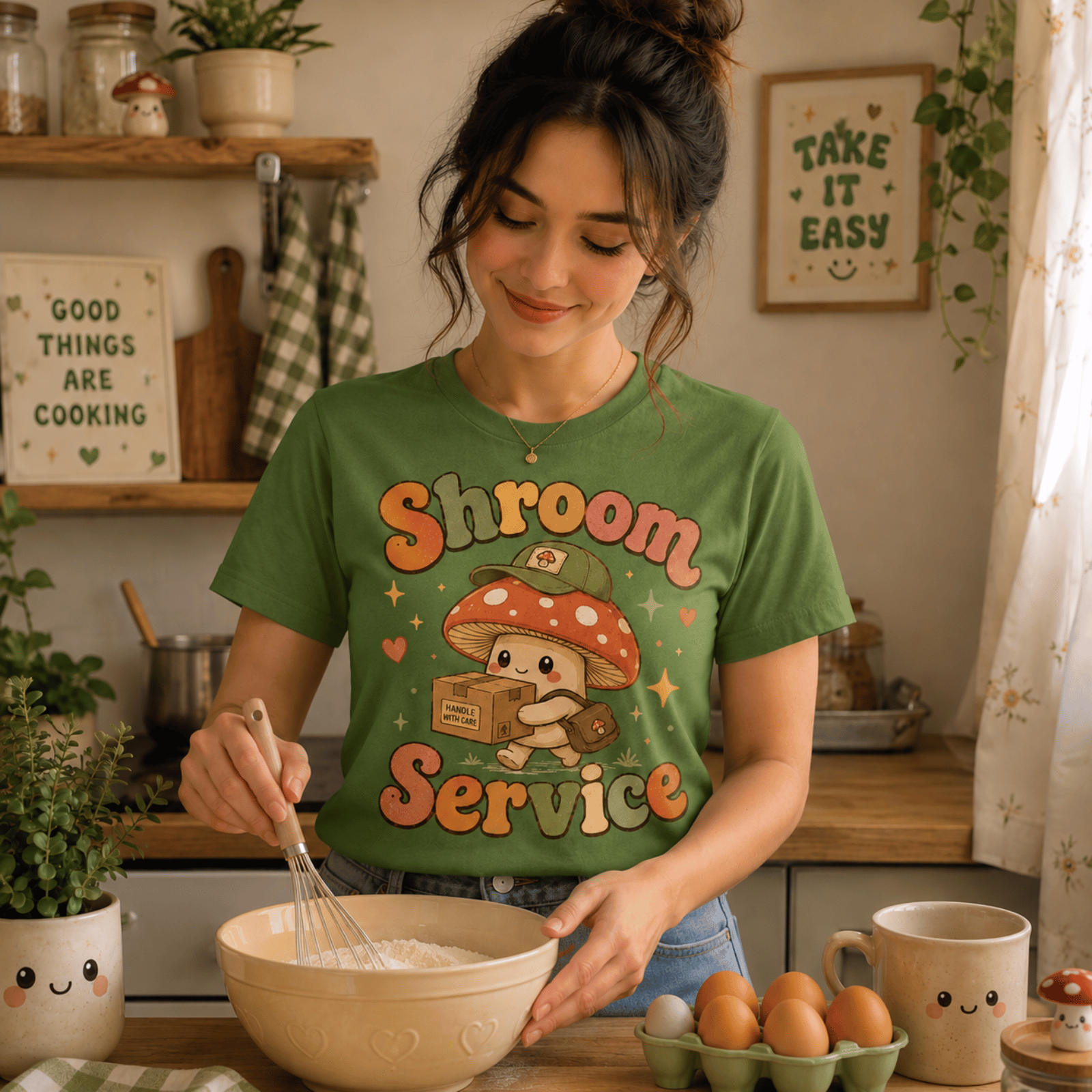 Woman wearing Shroom Service graphic t-shirt in leaf, stirring a baking bowl in kitchen.