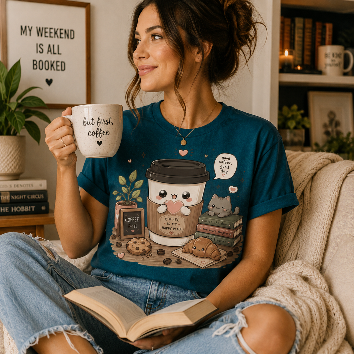 A woman wearing a deep teal Good Coffee cute coffee graphic t-shirt.