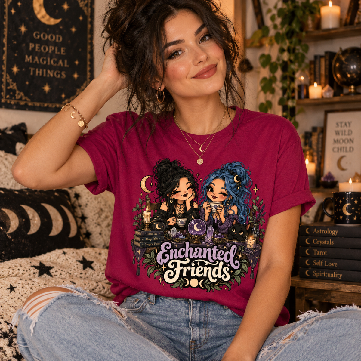 A woman wearing a berry Enchanted Friends cute celestial graphic t-shirt.
