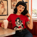 Woman wearing Boston Love pinup graphic t-shirt enjoying a milkshake at a diner.