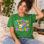 A woman wearing a leaf Stardust cute celestial graphic t-shirt.