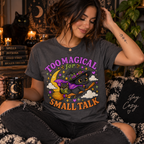 A woman wearing an asphalt Too Magical cute celestial graphic t-shirt.