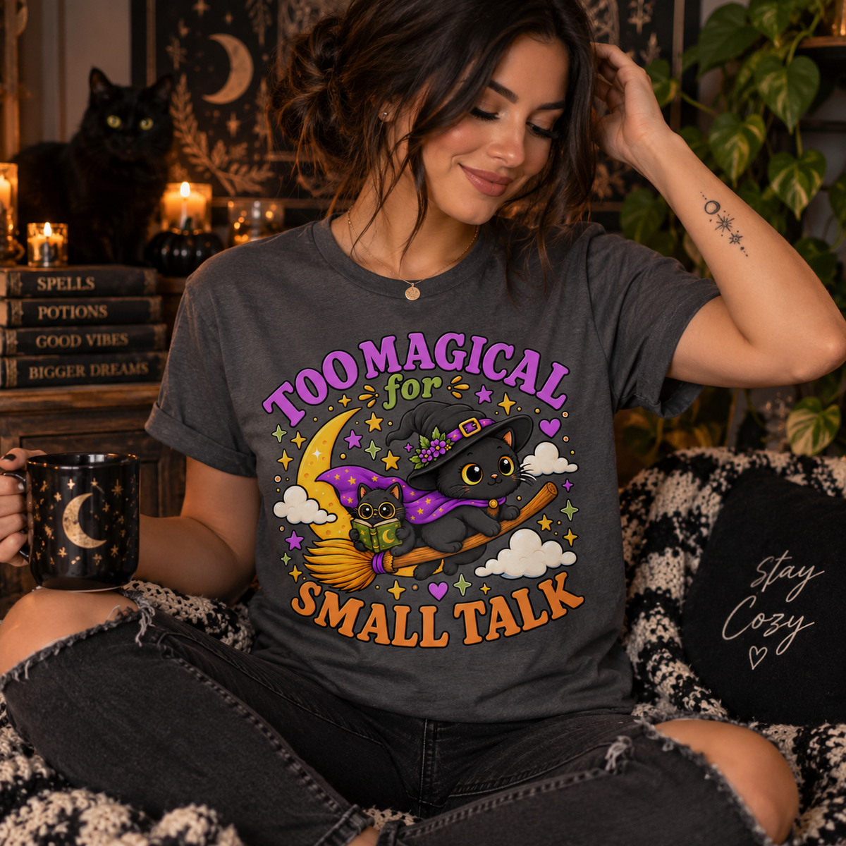 A woman wearing an asphalt Too Magical cute celestial graphic t-shirt.