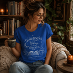 A woman wearing a true royal Quietness Today book quote graphic t-shirt in a cozy library.